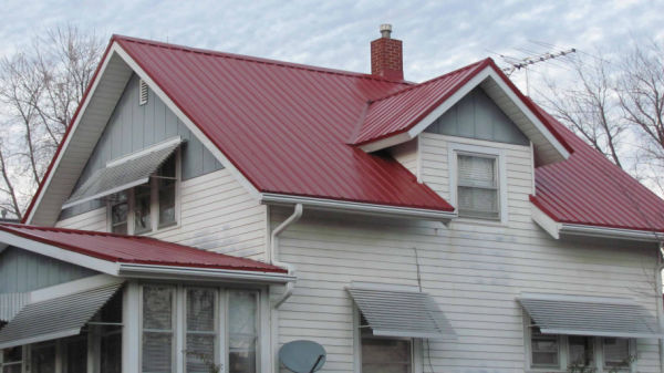 red metal roof on two story home 600w